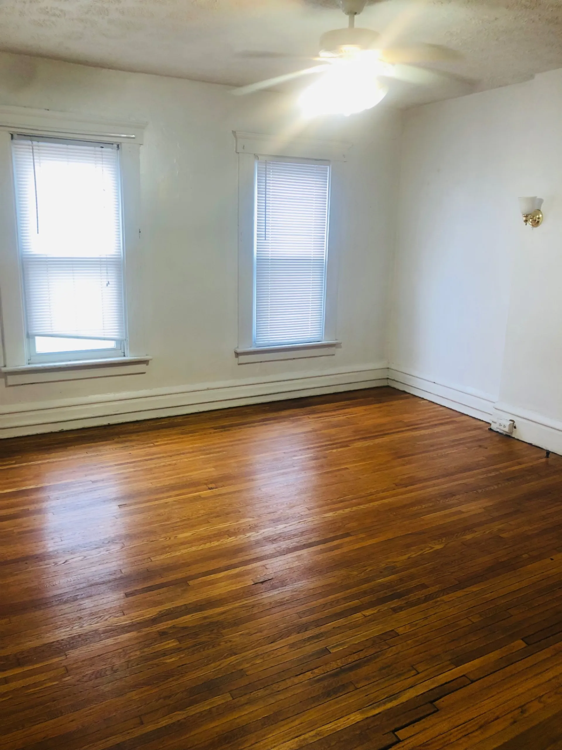 119 W 9th bedroom with hardwood floors and dual windows