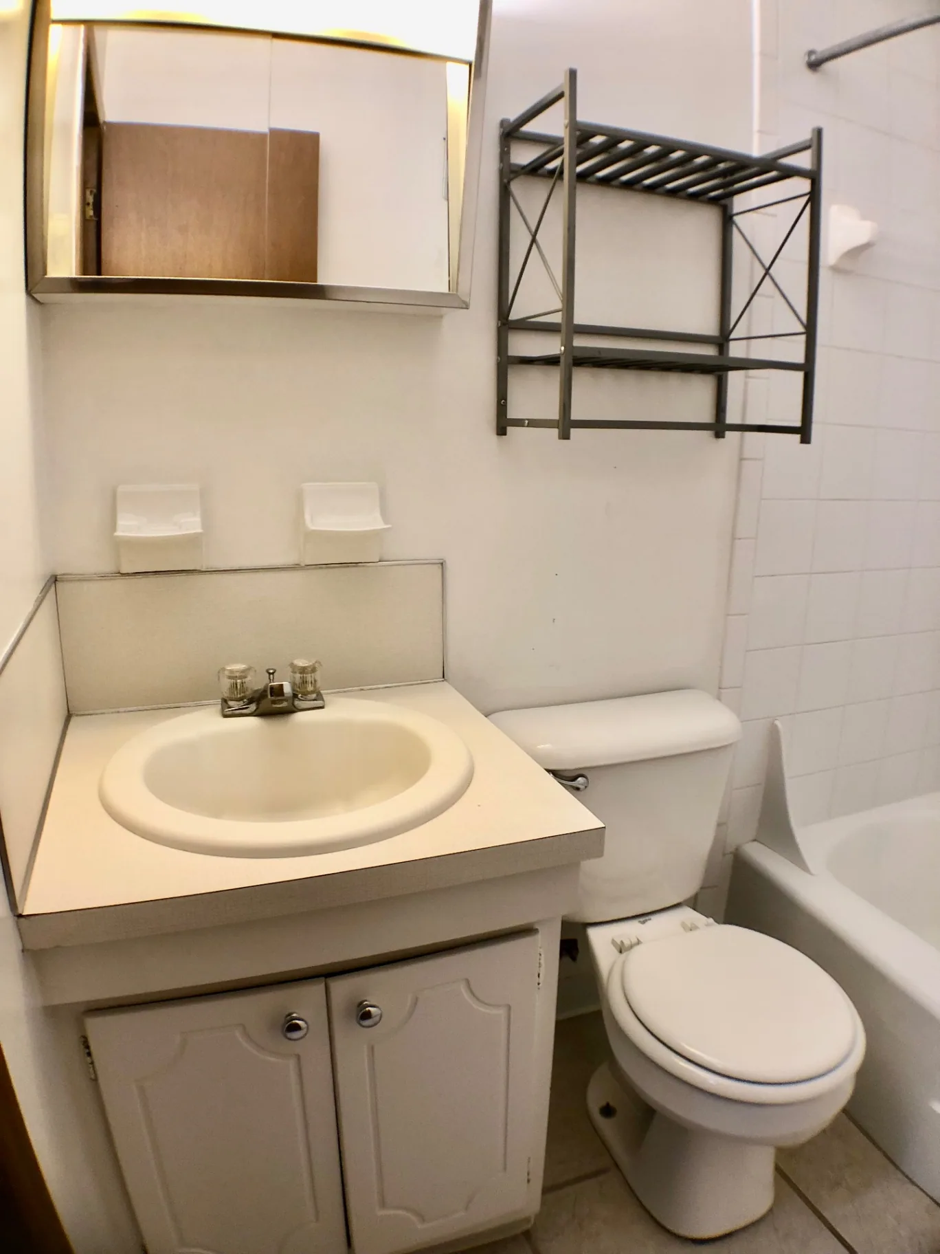 2040 Iuka Ave. 5A bathroom vanity with mirror and overhead storage rack