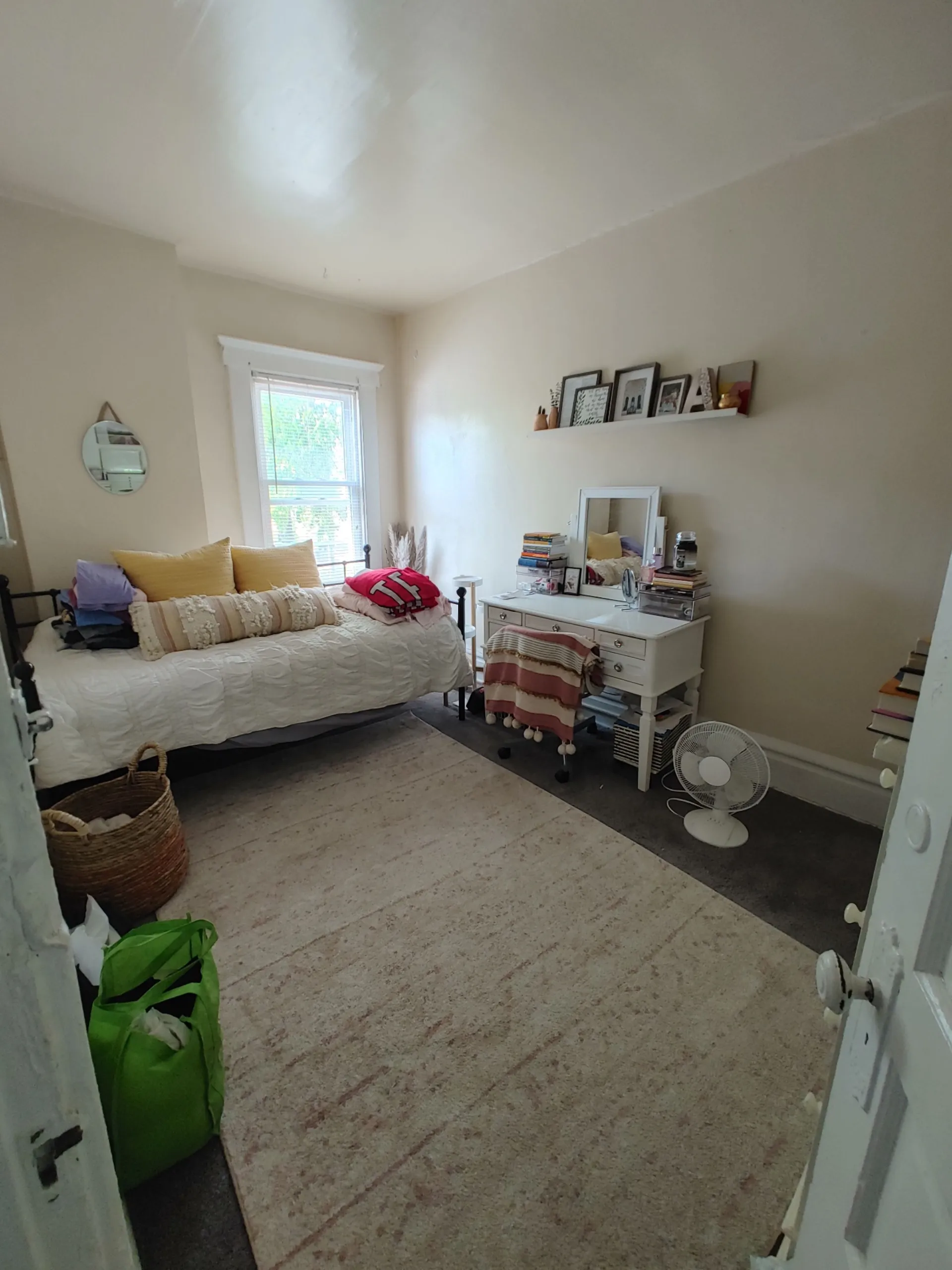 121 W 9th second bedroom with daybed, vanity, and bright window