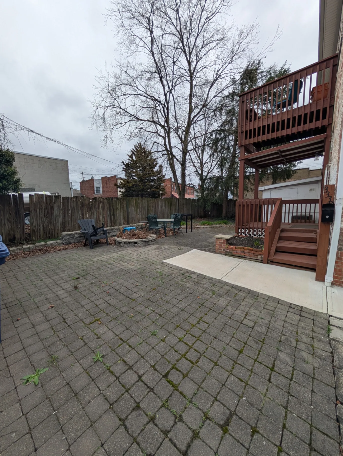3338 Chestnut wide view of the shared back patio with fire pit and seating area