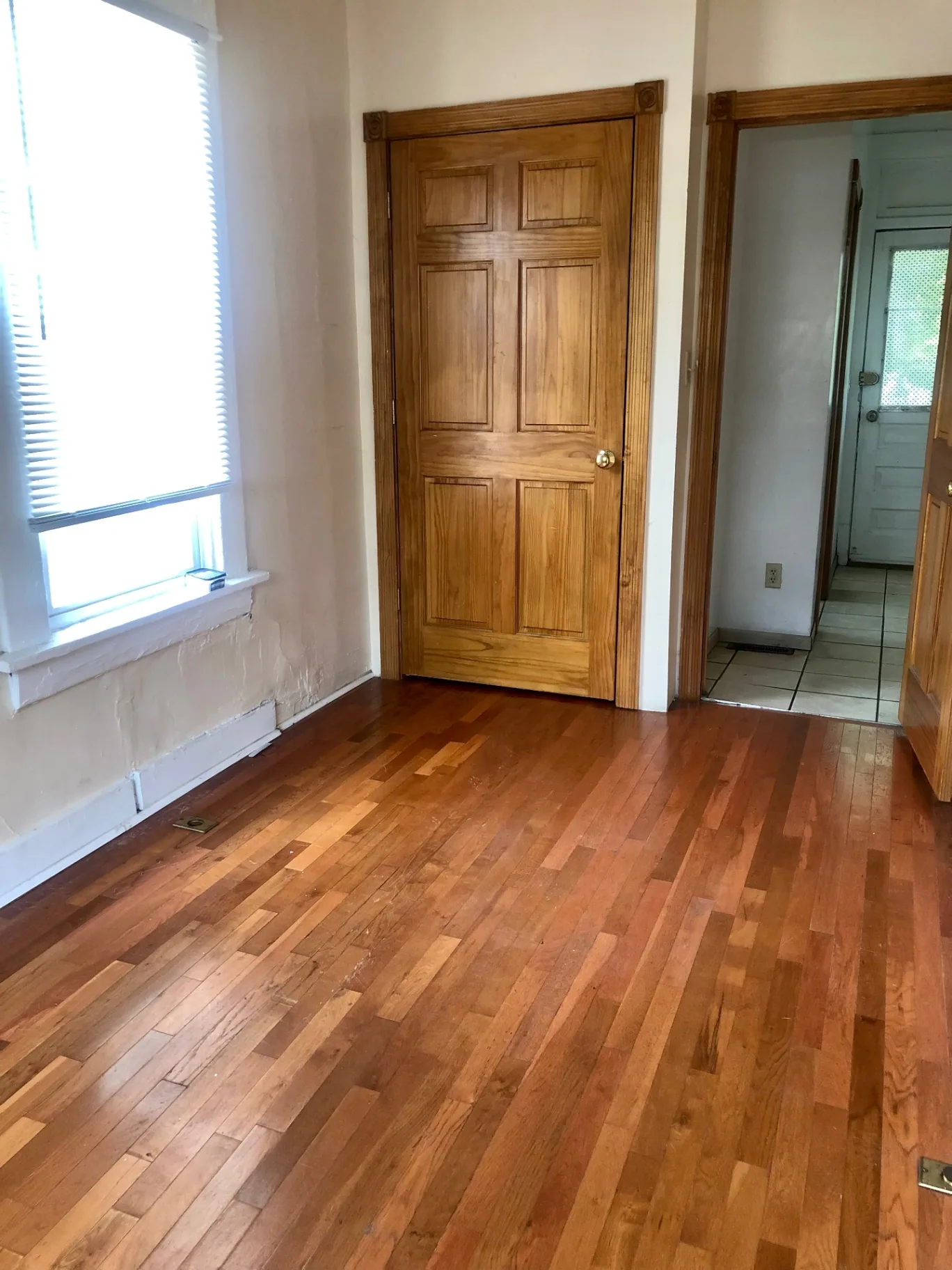 77 E Patterson Ave. hardwood-floor bedroom with paneled door and view to tiled kitchen