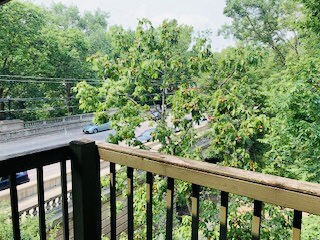 2024 Summit St. private balcony overlooking the wooded Iuka Ravine