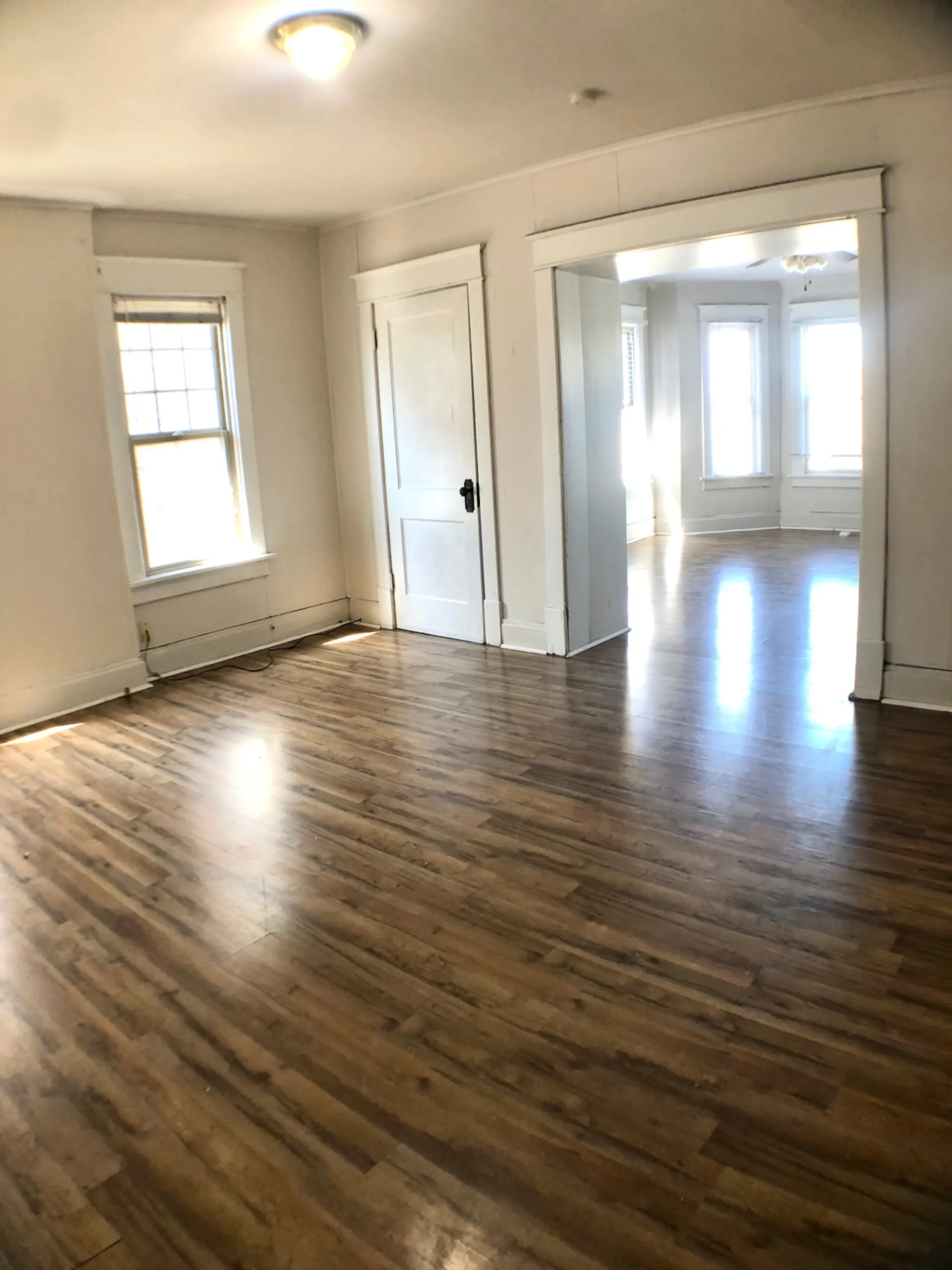 1814 Summit St. bonus front room with hardwood floors and open doorway to the living room