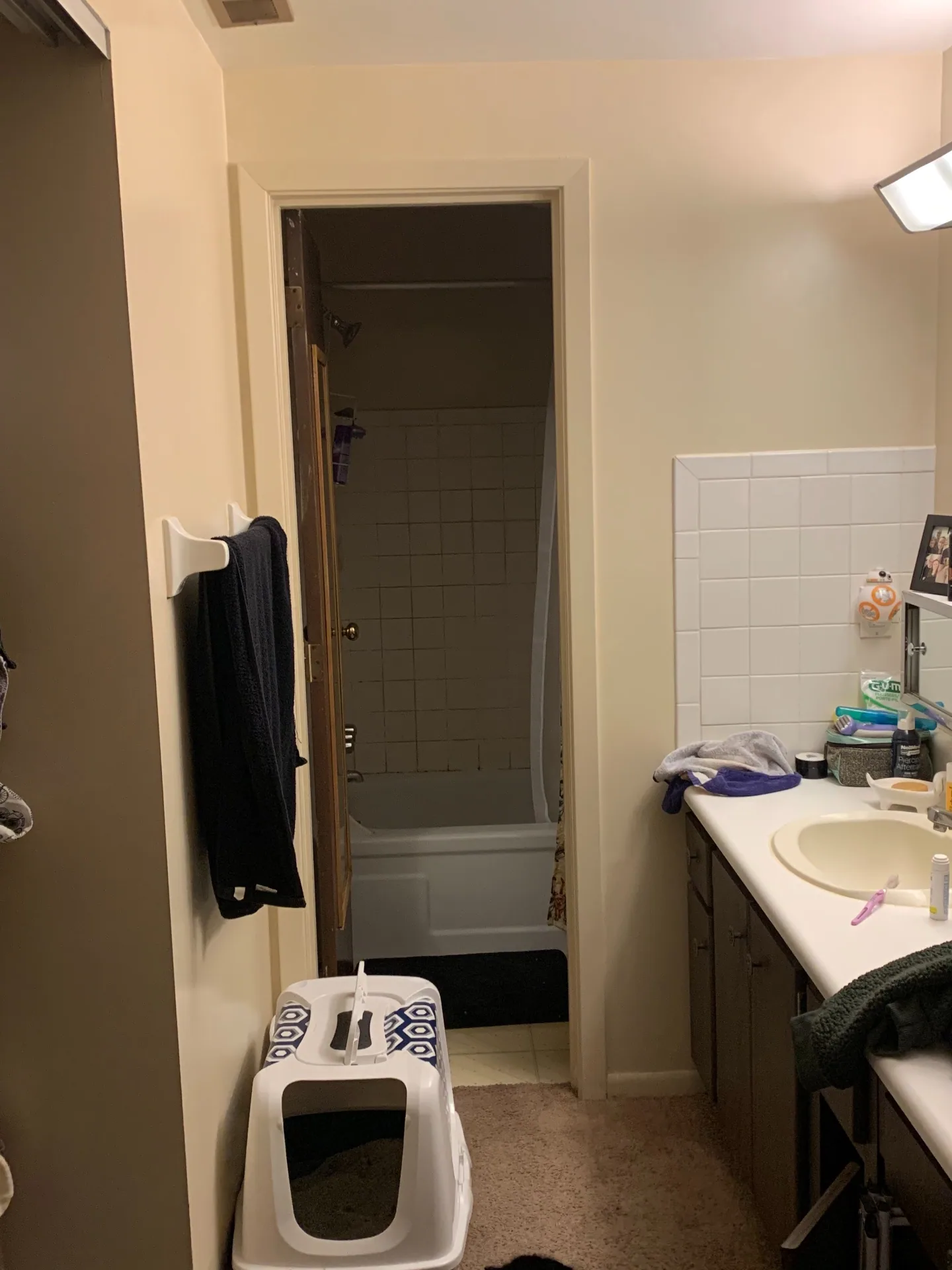 2030 Summit St Unit 1 bathroom with vanity, tub/shower, and linen closet