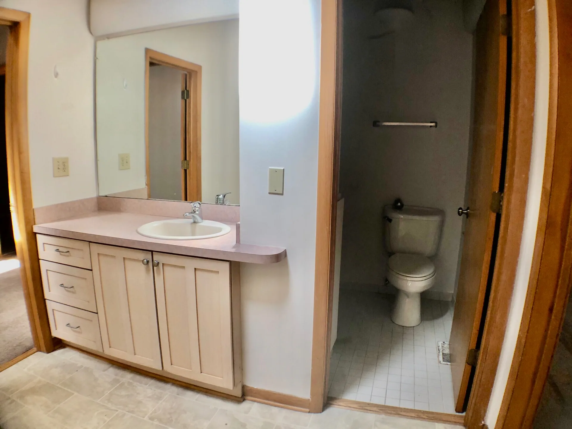 2040 Iuka Ave House bathroom with vanity, mirror, and separate toilet room