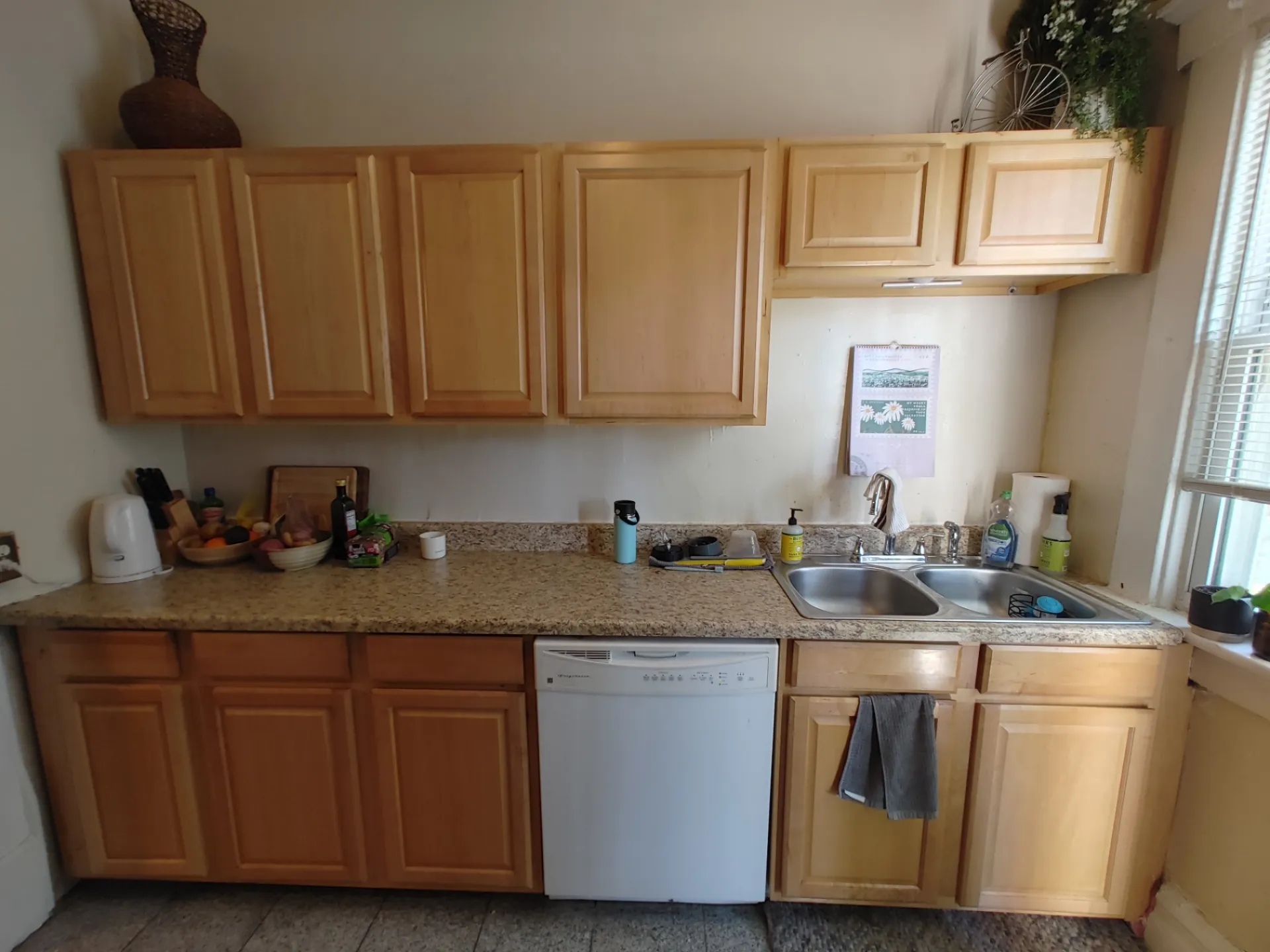 117 W 9th kitchen with maple cabinets, granite counters and double basin sink